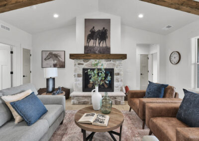 Cozy and bright living room with a brick fireplace and wood beams